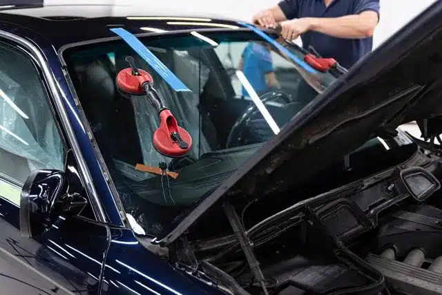 Car interior with the windshield removed and tape along the dash