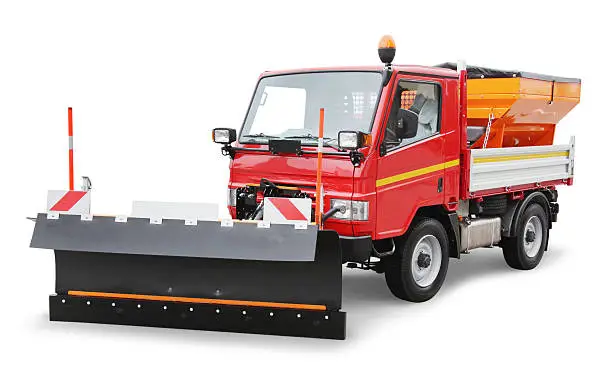 Red utility truck with a front plow blade and dump bed