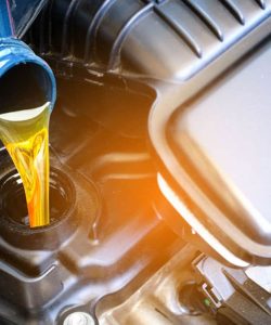 Oil being poured into a motorcycle engine