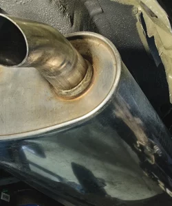 Close-up of a chrome muffler and exhaust tip