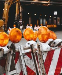 Orange warning beacons on a barricade in a warehouse